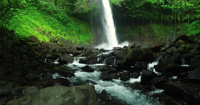 Costa Rica La Fortuna Waterfall in amazing rainforest nature landscape. Aerial drone video.