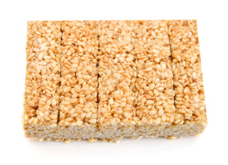 Honey bars with sesame seeds on white background