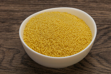 Raw cous cous heap in the bowl