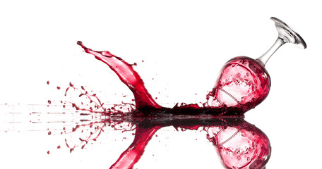 Dropped glass of red wine on a white background