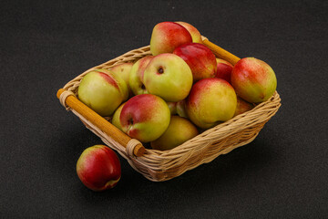 Sweet small nectarines in the basket