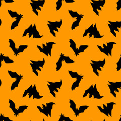 Fototapeta premium Seamless pattern of bats.Silhouette of black bats on an orange background. Design for Halloween. Flat vector illustration