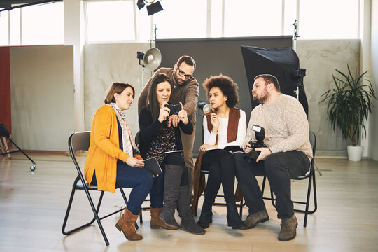 Attendees attending a photography course in studio.