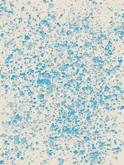 Blue watercolour drops splash on light yellow background. Paint splatter. 