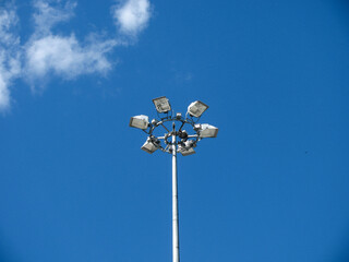 Circular foodlight for the lighting of sports events on a background of blue sky