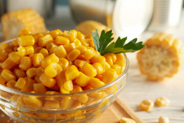 Composition with fresh raw corn on white wooden background, close up