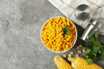 Composition with fresh raw corn on gray background, top view