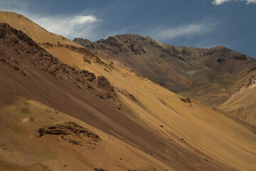 Fototapeta na wymiar Nature textures and colors. Geology. closeup view of the arid mountain peak. 