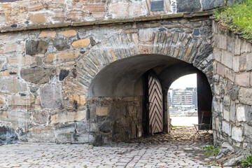 View on Oslo city through old gates of Akershus Fortress in Oslo, Norway. European fort structure landmark