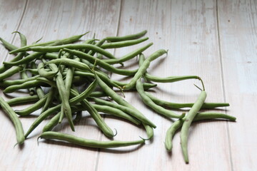 green beans on a wooden background