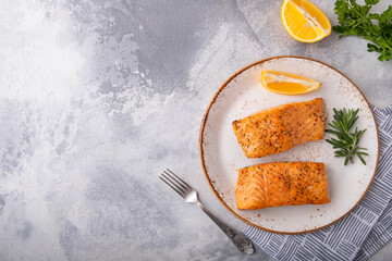 Tasty roasted salmon with spices. Copy space. Top view