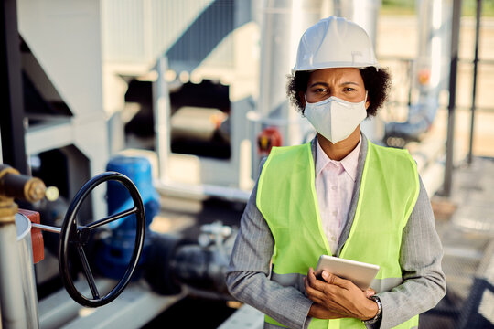 Portrait Of Female African American Civil Engineer With Protective Face Mask.