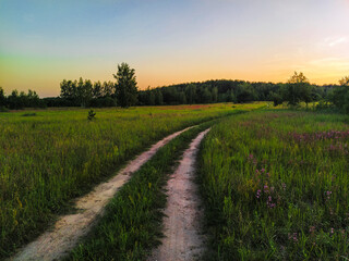 Fototapeta na wymiar image of a country road in a field