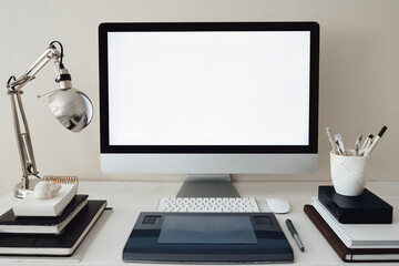 Modern stylish personal computer with a white screen. Freelance artist or designer workplace. Clean...