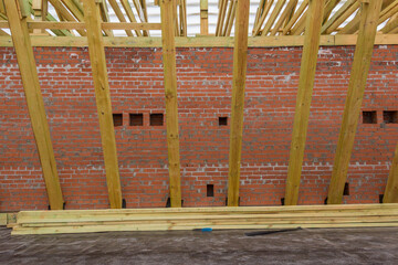 Rafter system of a wooden roof. Wooden construction. The construction of the roof of a residential building.