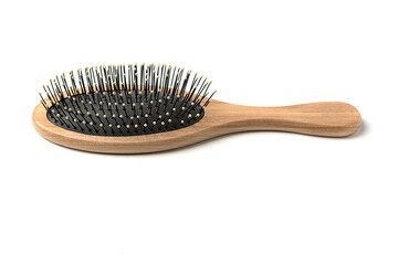 Beauty Tools. Massage hairbrush with wooden handle on a white background
