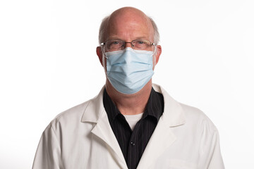 Portrait of male university professor wearing Covid 19 mask and lab coat isolated on white background