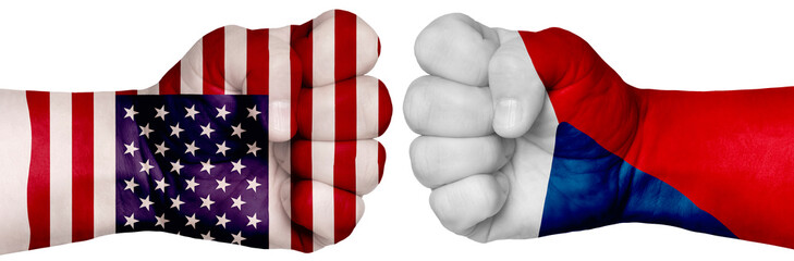 Two hands are clenched into fists and are located opposite each other. Hands painted in the colors of the flags of the countries. Czech Republic vs USA