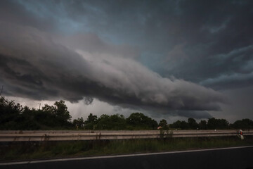 Black storm clouds above highway