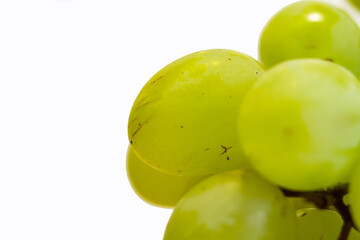 Bunch of Green Seedless Grape solated on white background.