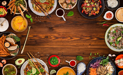 Asian food background with various ingredients on rustic wooden background , top view. Vietnam or Thai cuisine.