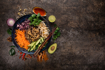 Bun bo nam bo asian food background with various ingredients on rustic stone background , top view....