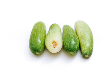 fresh green cucumbers lined up neatly. with isolated white background. copy space