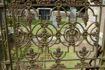 Beautiful old  iron railings matured with with rust and lichens  at the Auld Kirk of Kemback.