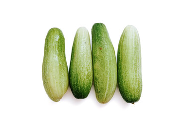 fresh green cucumbers with a background isolated white background