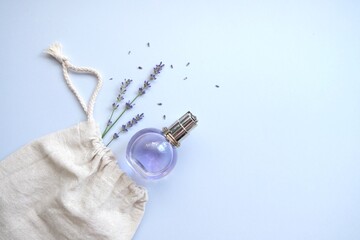 Composition with natural lavender cosmetics product and flowers in eco bag. Natural organic cosmetic concept.Lavender water.