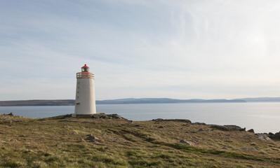 Fototapeta na wymiar Landscape with lighthouse at Vatnsnes Peninsula, Iceland