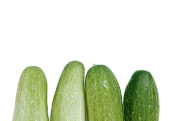 fresh green cucumbers with a background isolated white background with copyspace