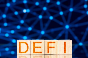 defi concept. wooden blocks with the inscription defi (Decentralized Finance) and a distributed network in the background