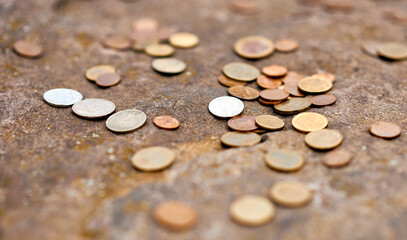coins scattered on stone silver brass copper