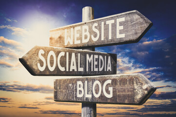 Website, social media, blog - wooden signpost, roadsign with three arrows