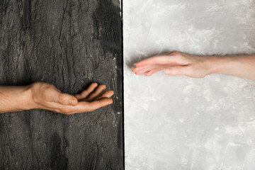 multi racial hand shake on black and white background. Stop racism concept