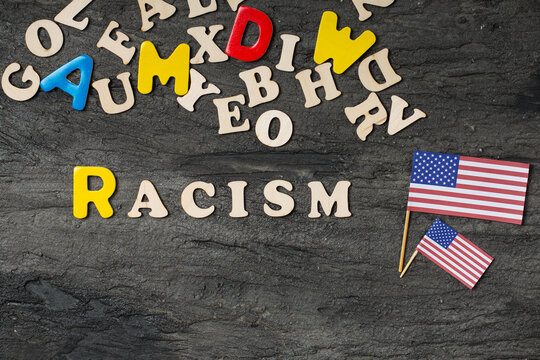 wooden letters with no racism words