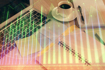 Multi exposure of forex graph drawing and desktop with coffee and items on table background. Concept of financial market trading
