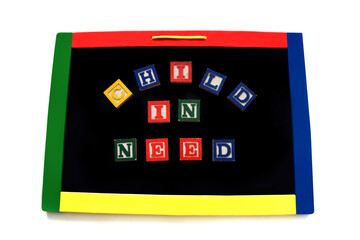 Blocks Letters Spell Child in Neesd on Magnetic Board