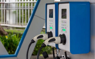 Electric car charging station. Hybrid car Electric charger station in the Car Park. Electric car charging on parking and charging station.