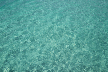 Clouds with blue sky over calm sea beach in tropical Maldives island. Summer sand beach and sea background. Ocean view beach.