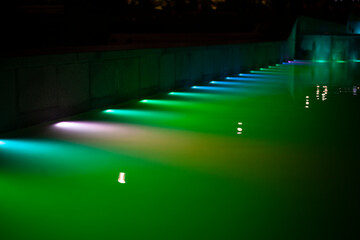 Illuminated pool water.