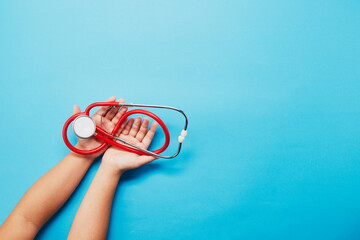 Child hand holds a doctor stethoscope, Healthcare medical