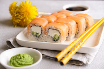 Philadelphia rolls on a white plate.