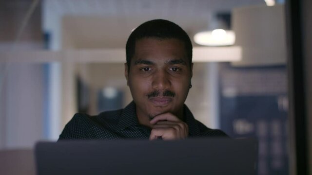 Inspiration strikes. A programer is working on the next big thing. Innovation is on its way. Diversity and creativity in action. Shot in slow-motion and in 4k. 