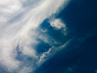 The sky and white clouds in the background