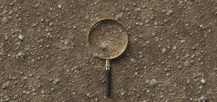 Magnification Glass On Dirt Gravel Background