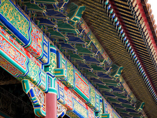 Detail of colorful traditional painting on the roof of Chinese temple