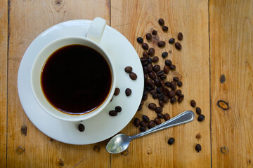 Coffee cups and coffee beans Resting on a wooden table