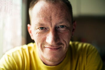 Portrait of a middle-aged man in close-up.